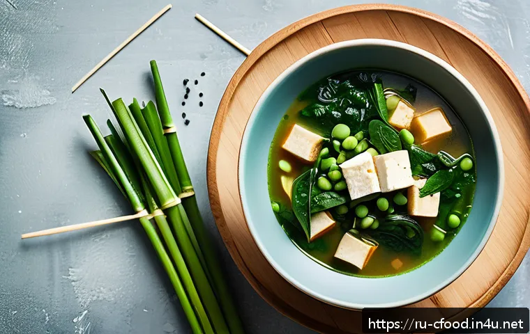 중식당 계절별 메뉴 - A vibrant spring Chinese dining scene featuring a delicate bowl of spinach and tofu soup, surrounded...